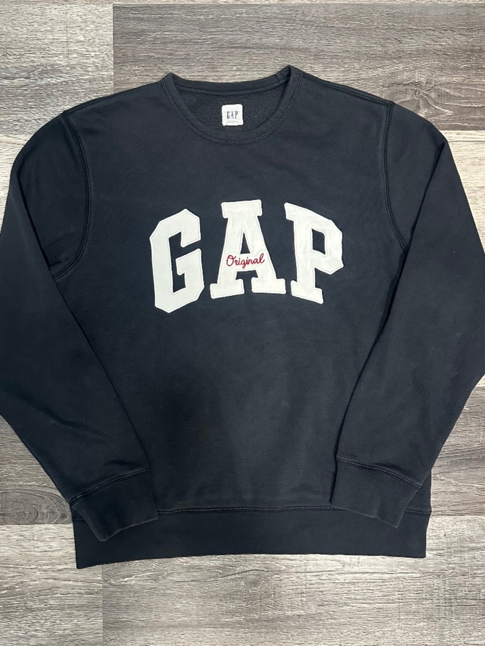 black GAP hoodie with big white lettering